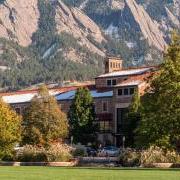 CU Boulder campus building with Flatirons in background